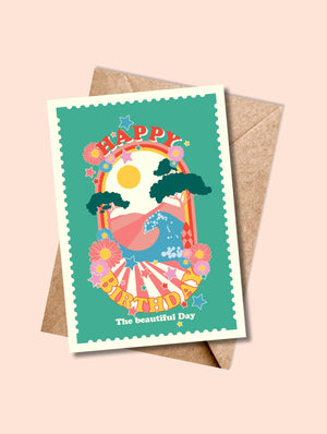 Carte de vœux HAPPY BIRTHDAY, Flower Power – version multicolor avec fleurs vives, arc-en-ciel, vague et soleil sur fond vert.