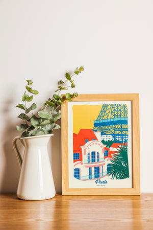 Carte postale illustrée intitulée "Paris, Les Toits" par Julie Roubergue, représentant une vue sur les toits de la capitale et sur la Tour Eiffel dans les tons vifs.